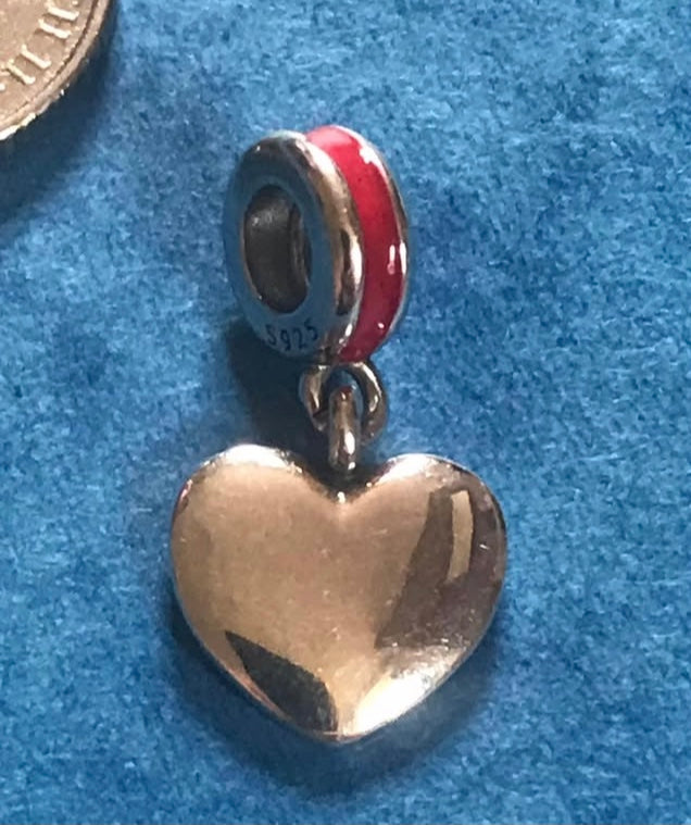 Heart-shaped pendant with red accent on a blue background USA