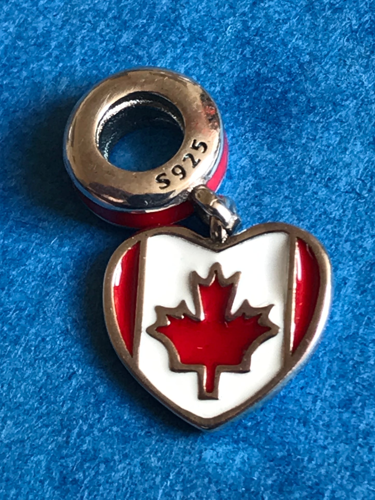 Genuine 925 Silver Canada Charm on a blue background for charm bracelet