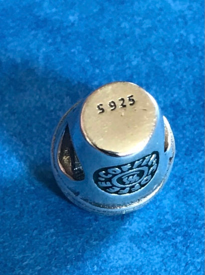 Silver Coffee Cup charm on a blue background