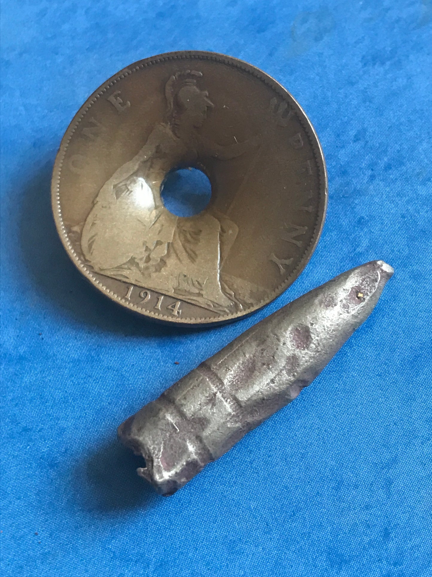 World War One Dated 1914 Coin damaged by Shrapnel during WW1 Trench Art Blitz Hole in coin Rare early complete with bullet #trenchart #ww2 #collectable #war