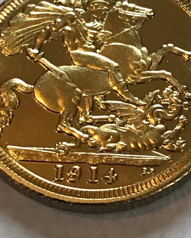 Gold coin with a horse emblem and '1914' inscription on a white background