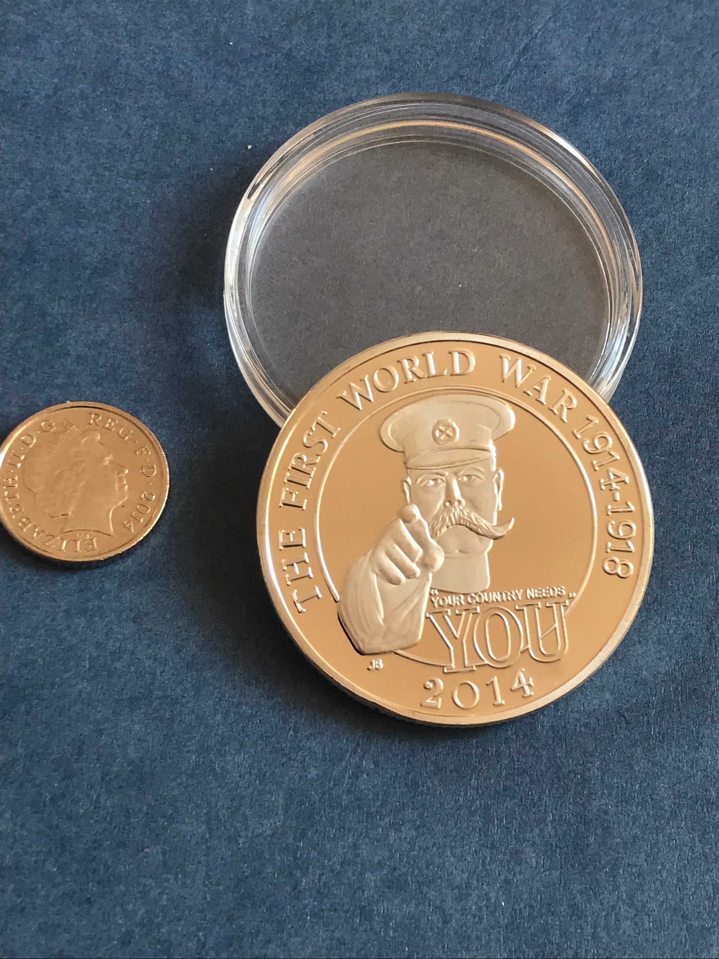 Gold coin with a clear case on a blue background