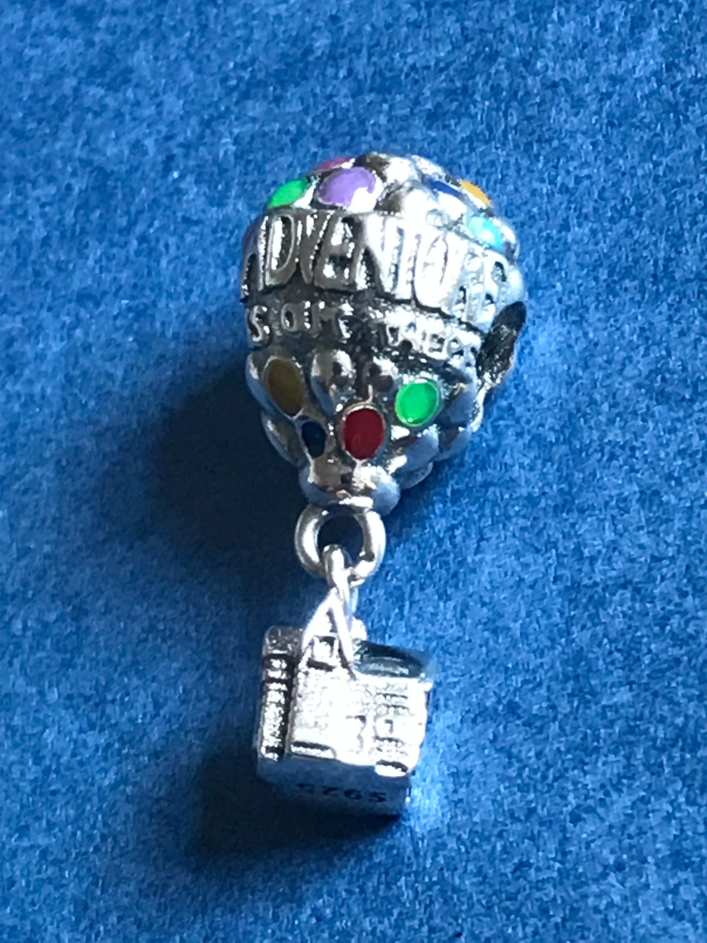 Genuine 925 Silver UP The Movie charm on a blue background