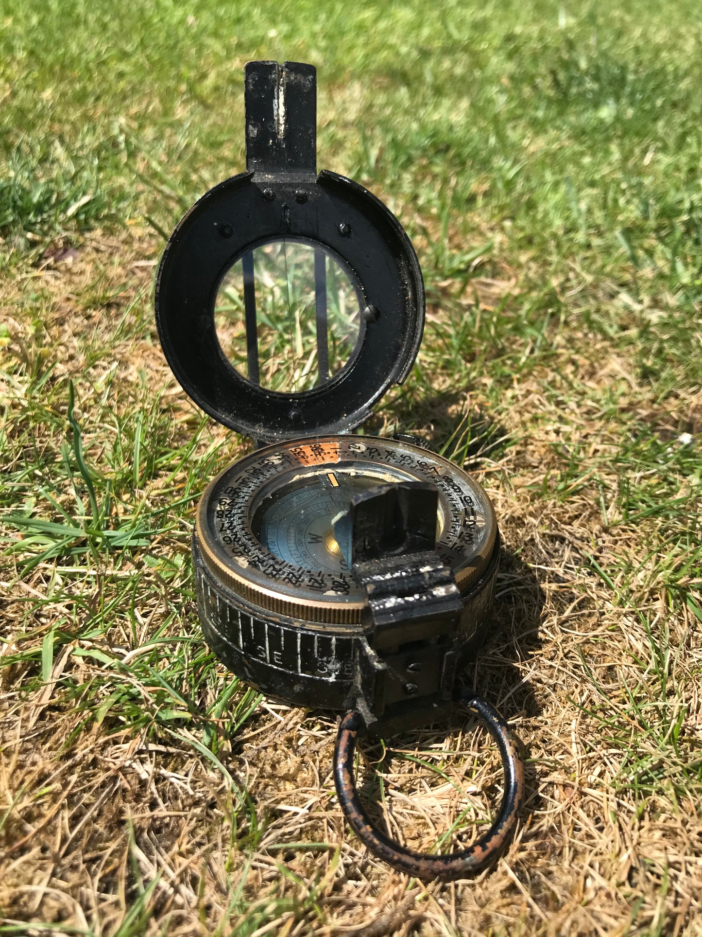 1944 dated WW2 vintage British compass on grass