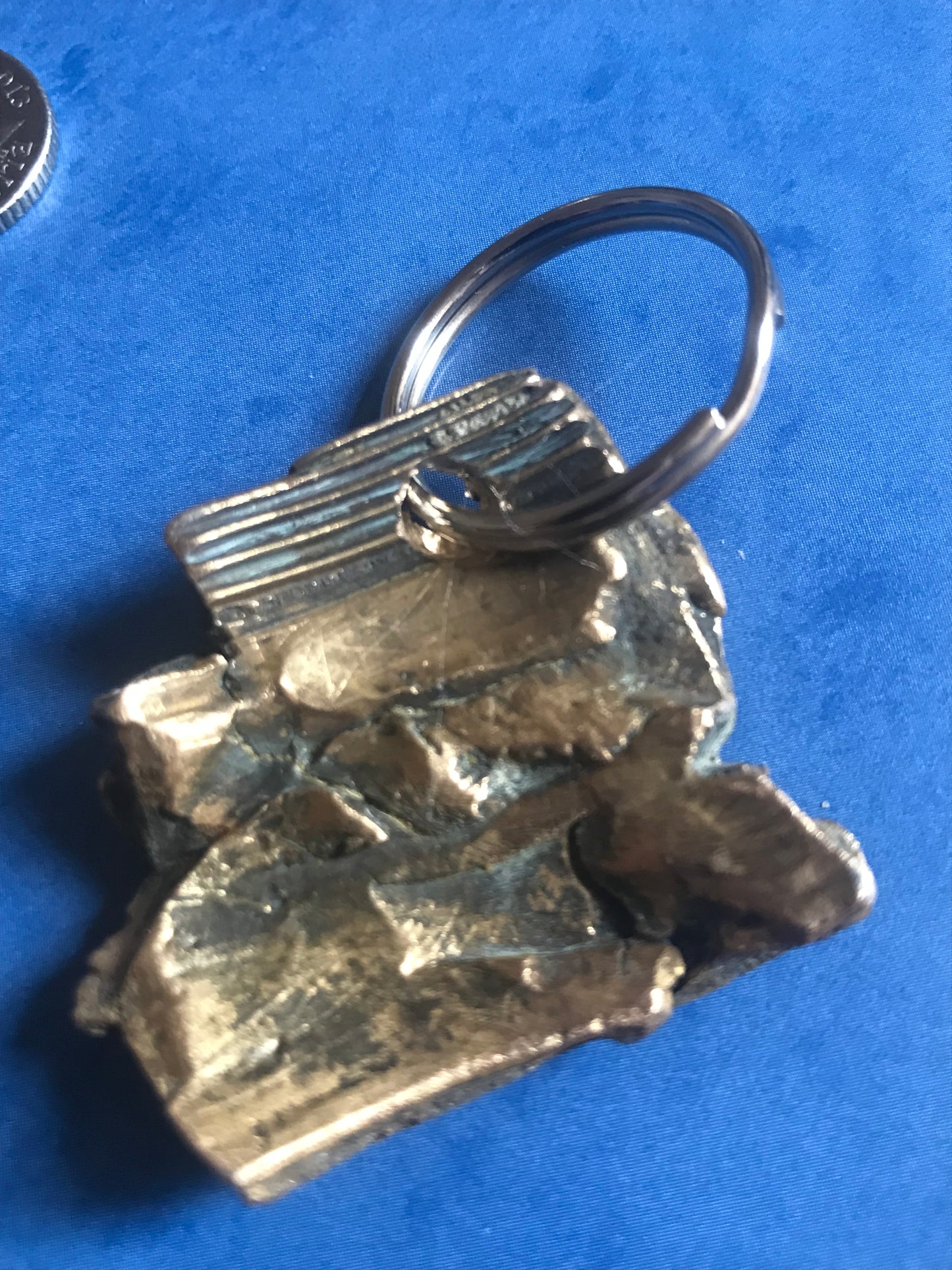 World War Two Battle of Britain Shrapnel key chains on a blue background