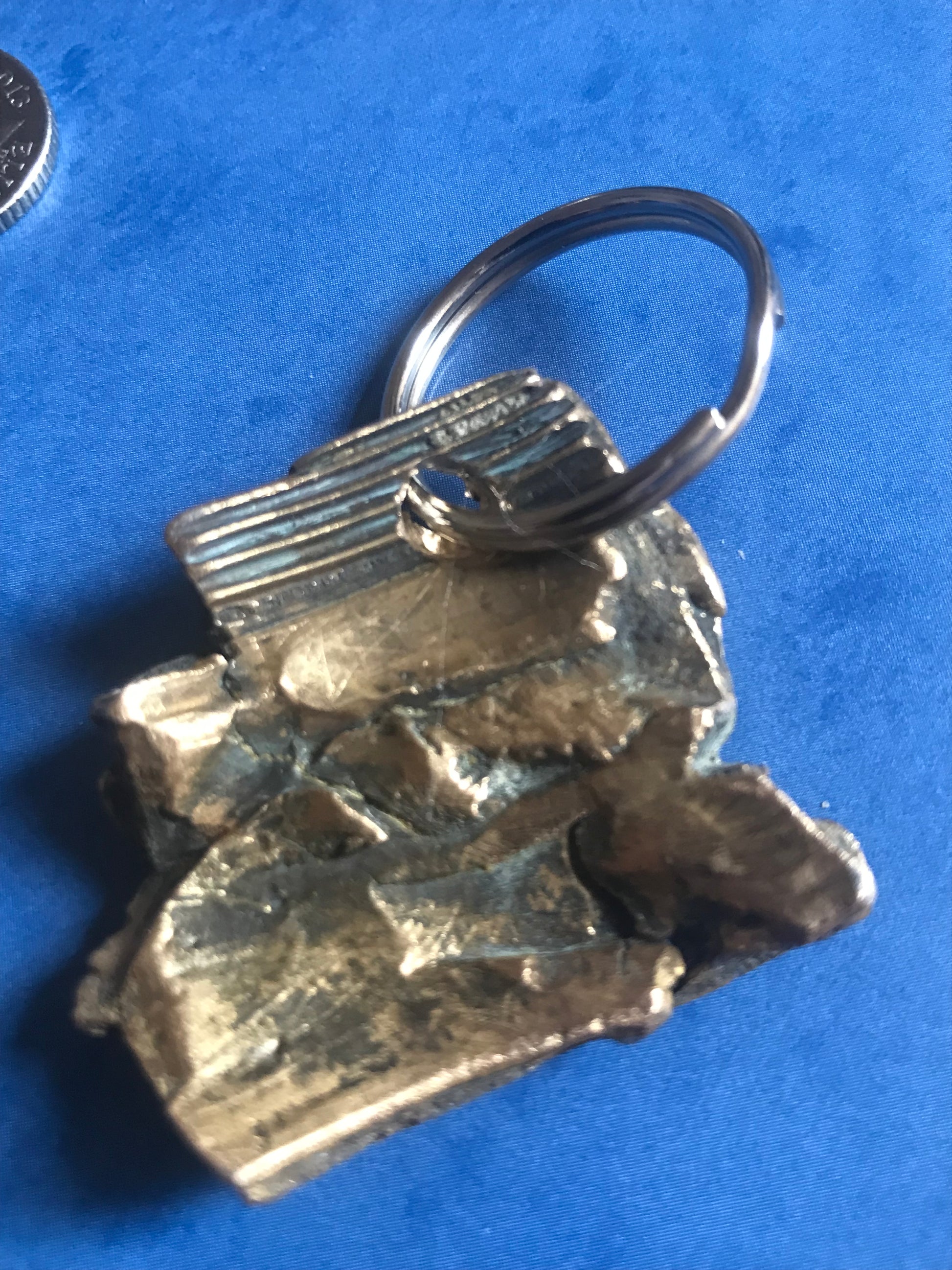 World War Two Battle of Britain Shrapnel key chains on a blue background