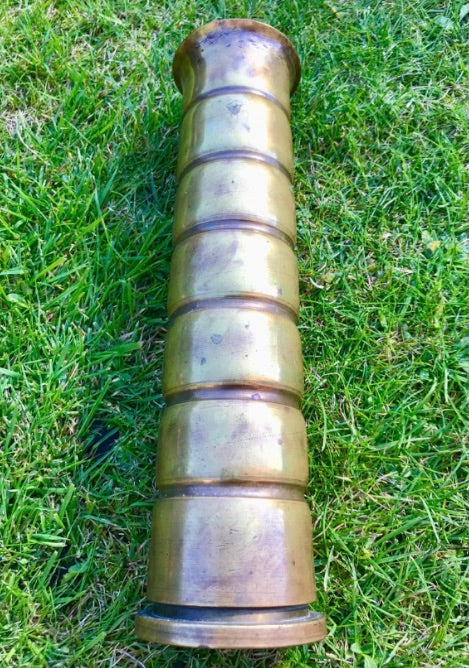 Brass World War Two Trench Art Vase on a grass background