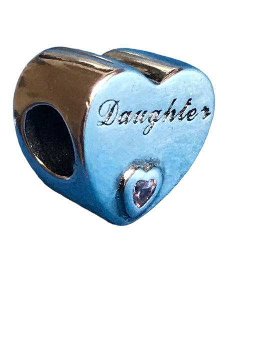 Heart-shaped charm with 'Daughter' engraving and pink gemstone on a white background