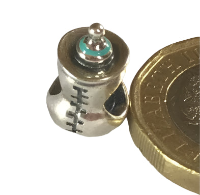 Silver Baby Bottle charm next to a gold coin on a white background for charm bracelet 925 silver