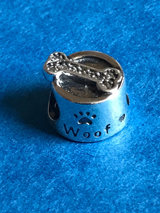 Silver charm with paw print and 'Woof' text on a blue background charm silver for charm bracelet 