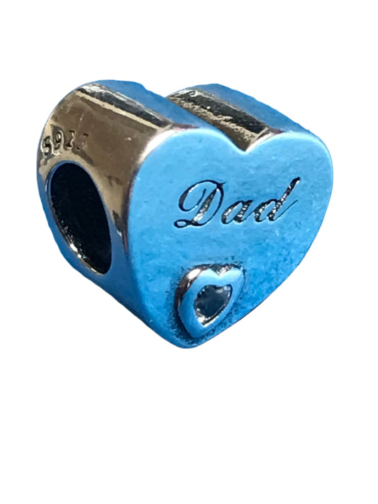 Silver heart-shaped charm with 'Dad' engraving on a white background