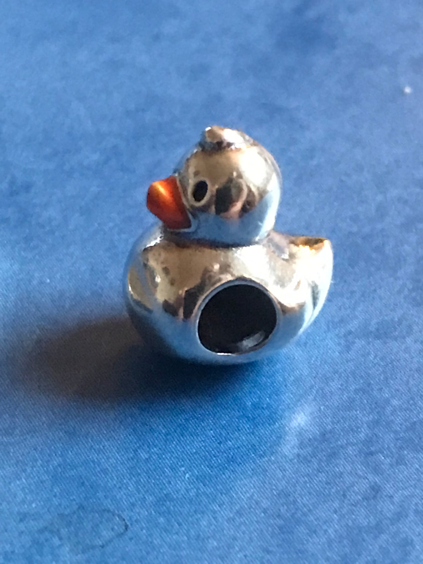 Silver Duck charm on a blue background for charm bracelet 