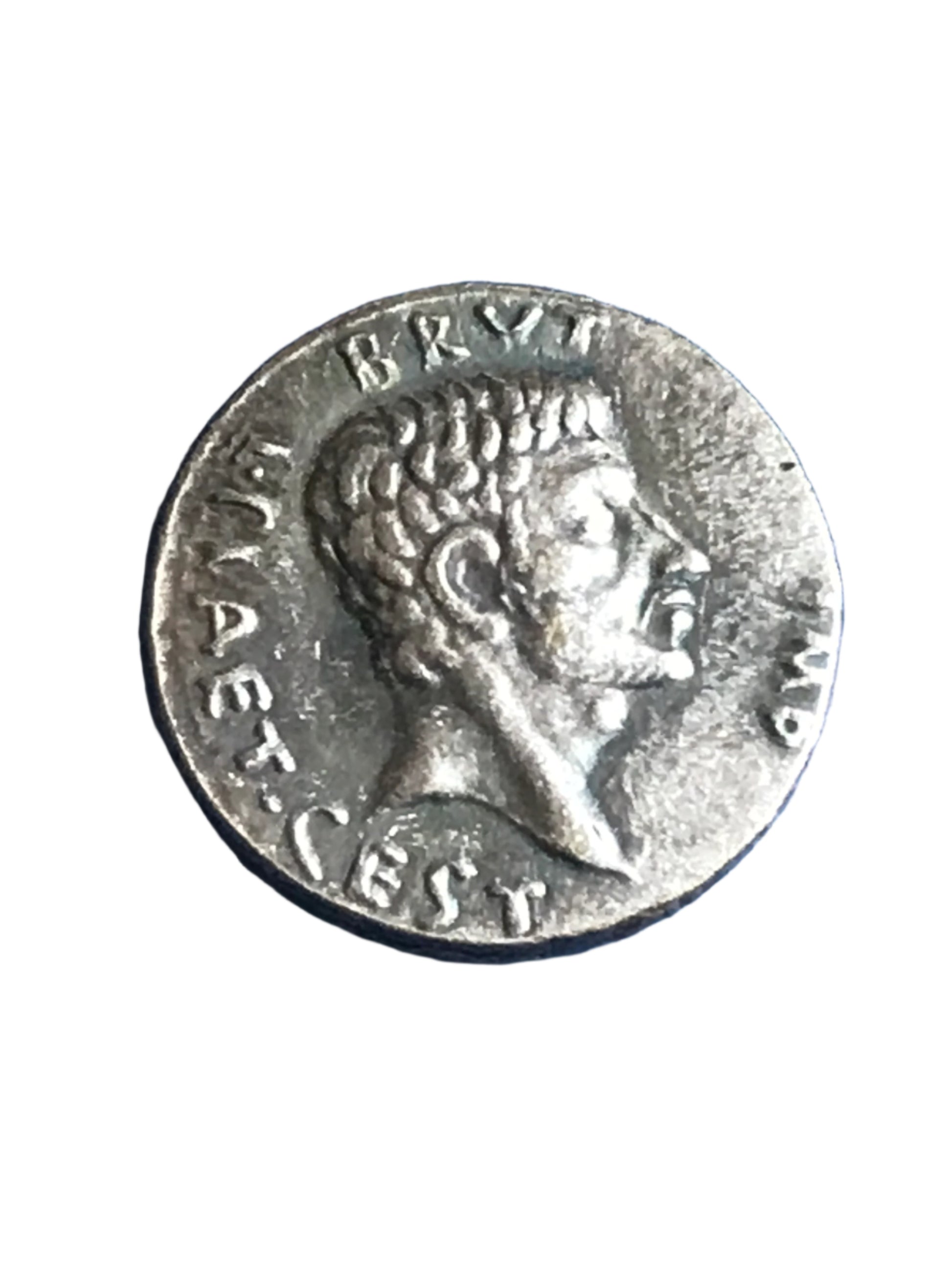 Ancient Roman coin with a profile of a person on a white background