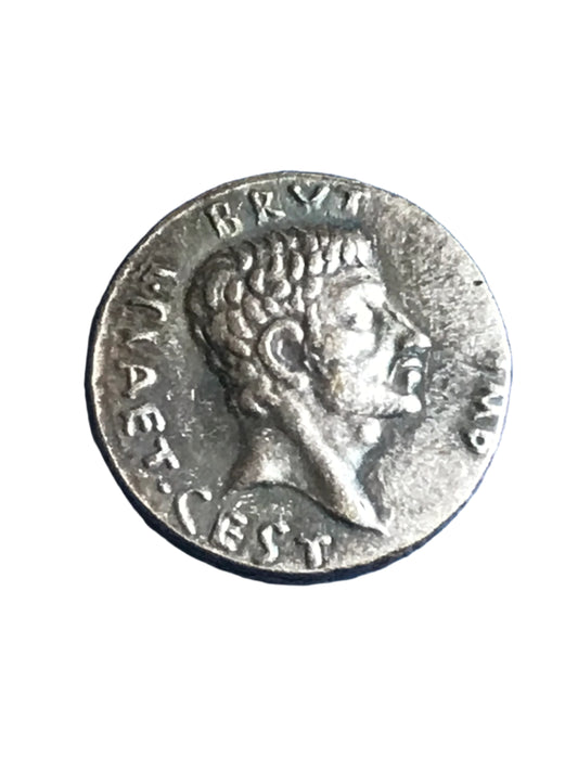 Ancient Roman coin with a profile of a person on a white background