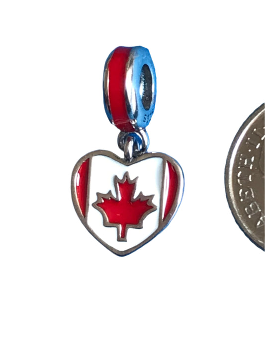Heart-shaped charm with Canadian flag design on a white background
