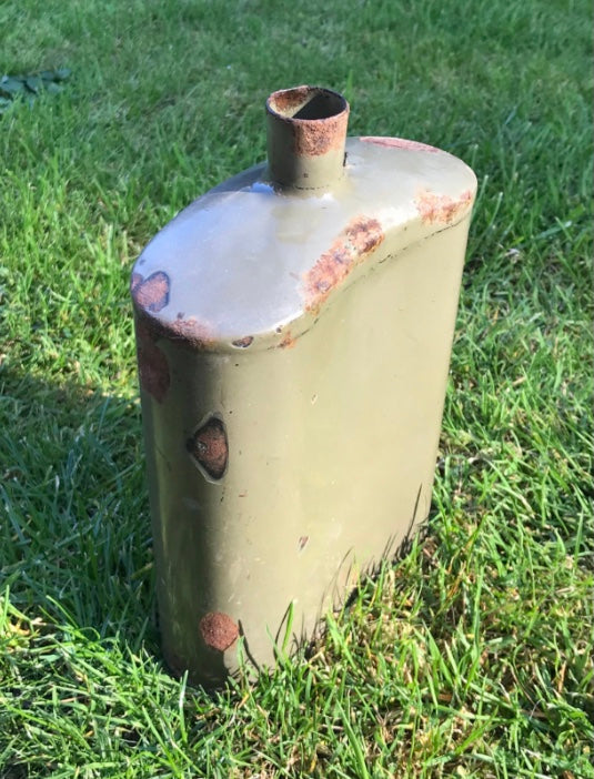Rust-covered WW2 British Army Water Bottle on grass