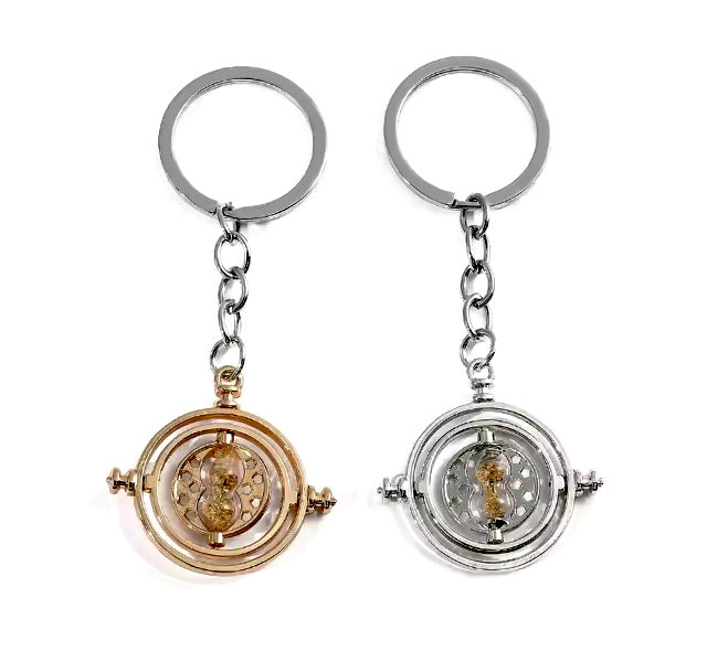 Two Harry Potter Time Turner Keyrings with intricate designs on a white background