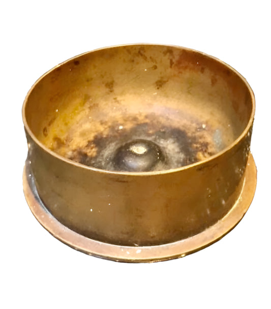 Brass WW1 Trench Art Ashtray with a worn interior on a white background