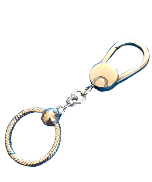 Gold and silver keychain for charms with rope design on a white background