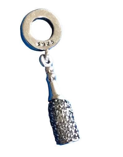 Silver champagne bottle charm with a glittery base on a white background