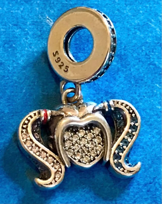 Genuine 925 Silver Harley Quinn charm on a blue background