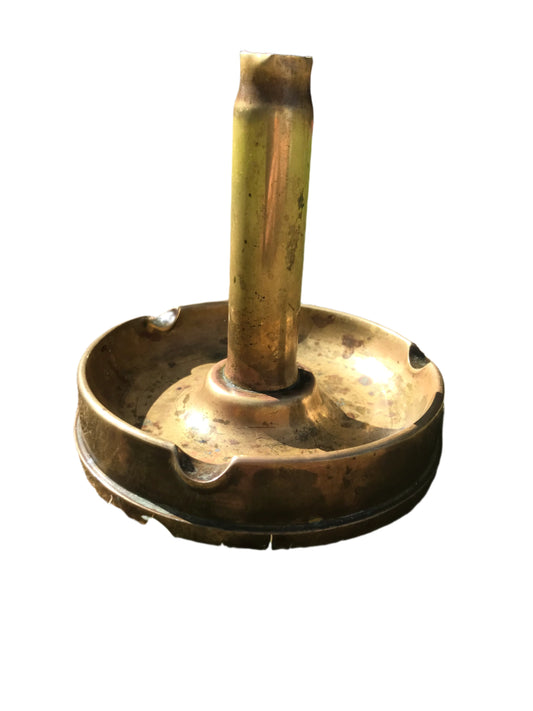 1945 dated trench art brass ashtray on a white background