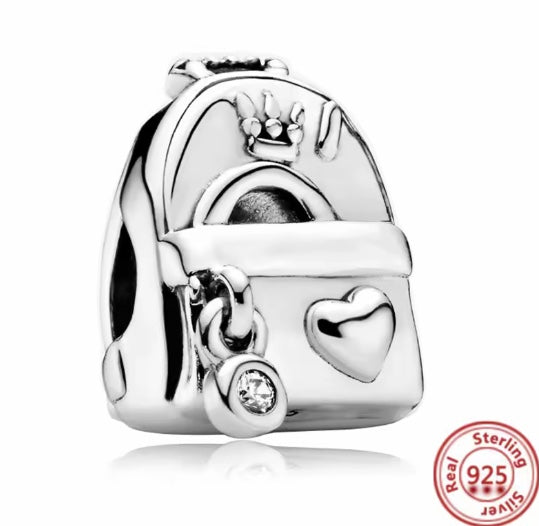 Silver charm with heart design and crown on a white background for charm bracelet 925 silver