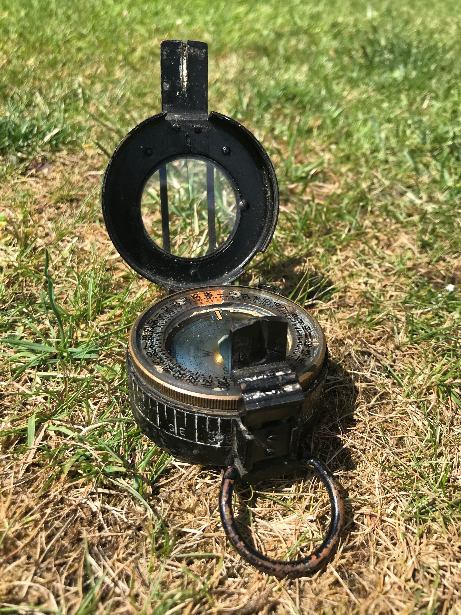 1944 dated WW2 vintage British compass on grass